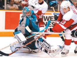 Sharks clinch playoffs, whip Wings