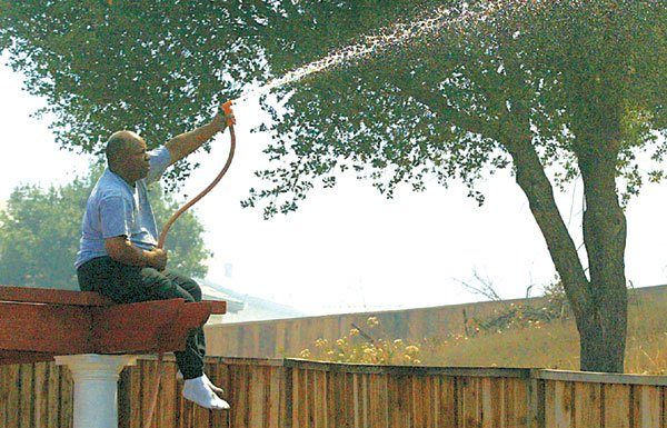 Residents in danger using hoses on fires