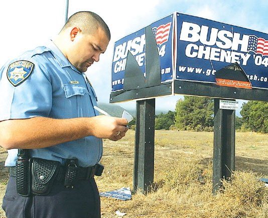 Vandals deface political signs