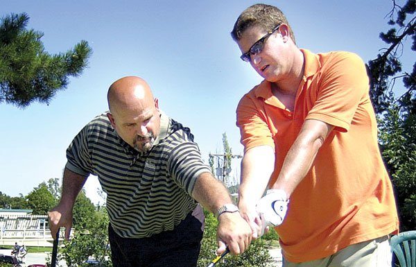 Golf, anyone? Instructors provide pointers to adults and kids