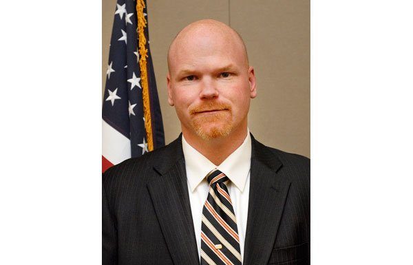 Who is behind the planned downtown arts center?