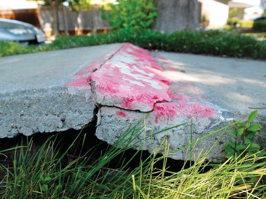 Full sidewalk repairs set, but financing issues linger