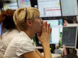 Markets stampede lower; global finance chiefs meet