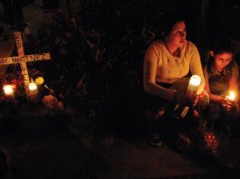 Fight mars vigil for slain 18-y-o, highlights gang tensions