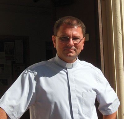 Well-traveled priest serves at St. Mary