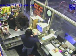 Two men rob gas station at gunpoint