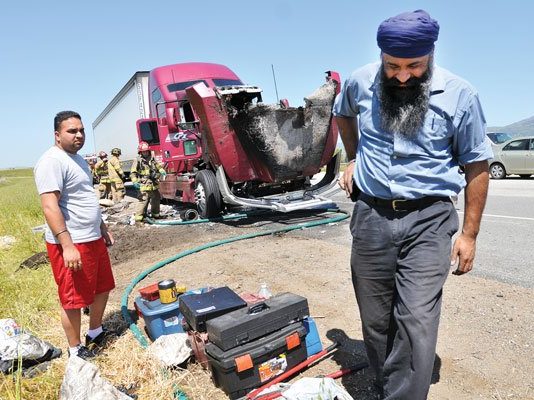 Big rig totaled after engine catches fire