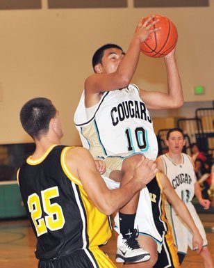 BOYS HOOPS: Cougars drop league opener to Wildcatz