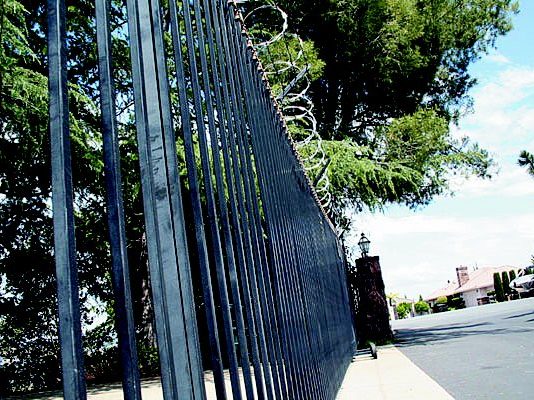 Former developer owes city $45K for barbed wire fence