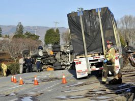 Overturned big-rig backs up traffic on Hwy. 152