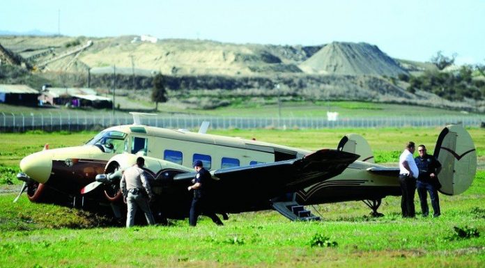 Airplane loses power on takeoff, hits grass bank off runway