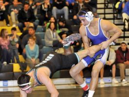 Wrestling: Olmos, Fox, Villarreal lead Mustangs by rival Cougars