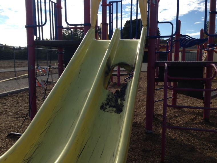 Vandals set slide on fire at MH elementary school