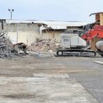 Image for display with article titled Photo: Vacant shopping center demolished