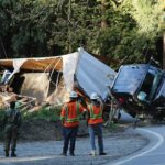 Image for display with article titled PHOTOS: Big rig flips over on Highway 152