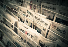A newsrack of German-language newspapers