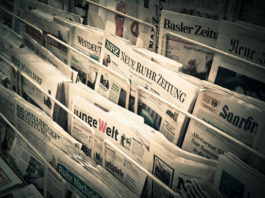 A newsrack of German-language newspapers