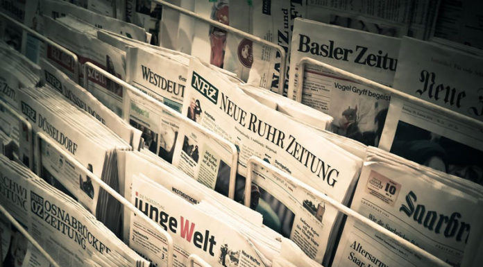 A newsrack of German-language newspapers