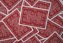 Following the Money: How Comparison Platforms Highlight the Best Payout Casinos Scattered red playing cards.