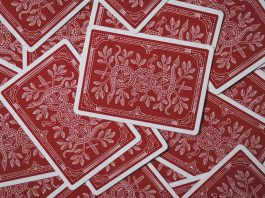 Following the Money: How Comparison Platforms Highlight the Best Payout Casinos Scattered red playing cards.