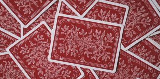 Scattered red playing cards.