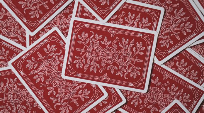 Following the Money: How Comparison Platforms Highlight the Best Payout Casinos Scattered red playing cards.