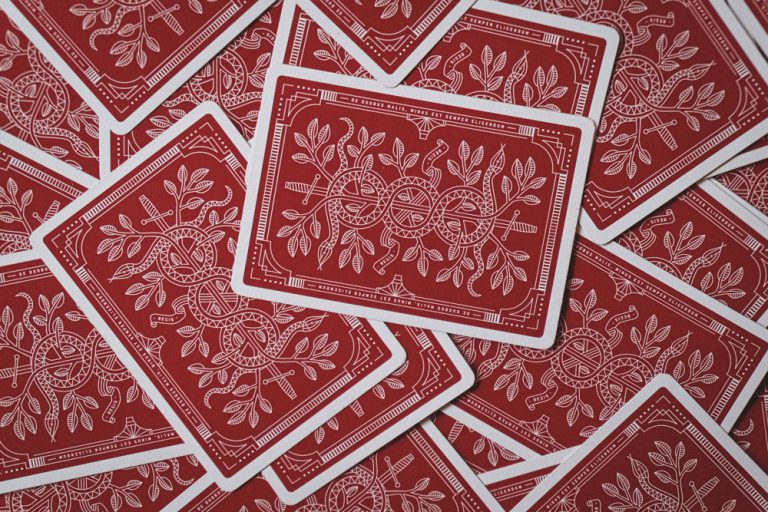 Scattered red playing cards.