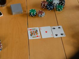 Playing cards on brown wooden table